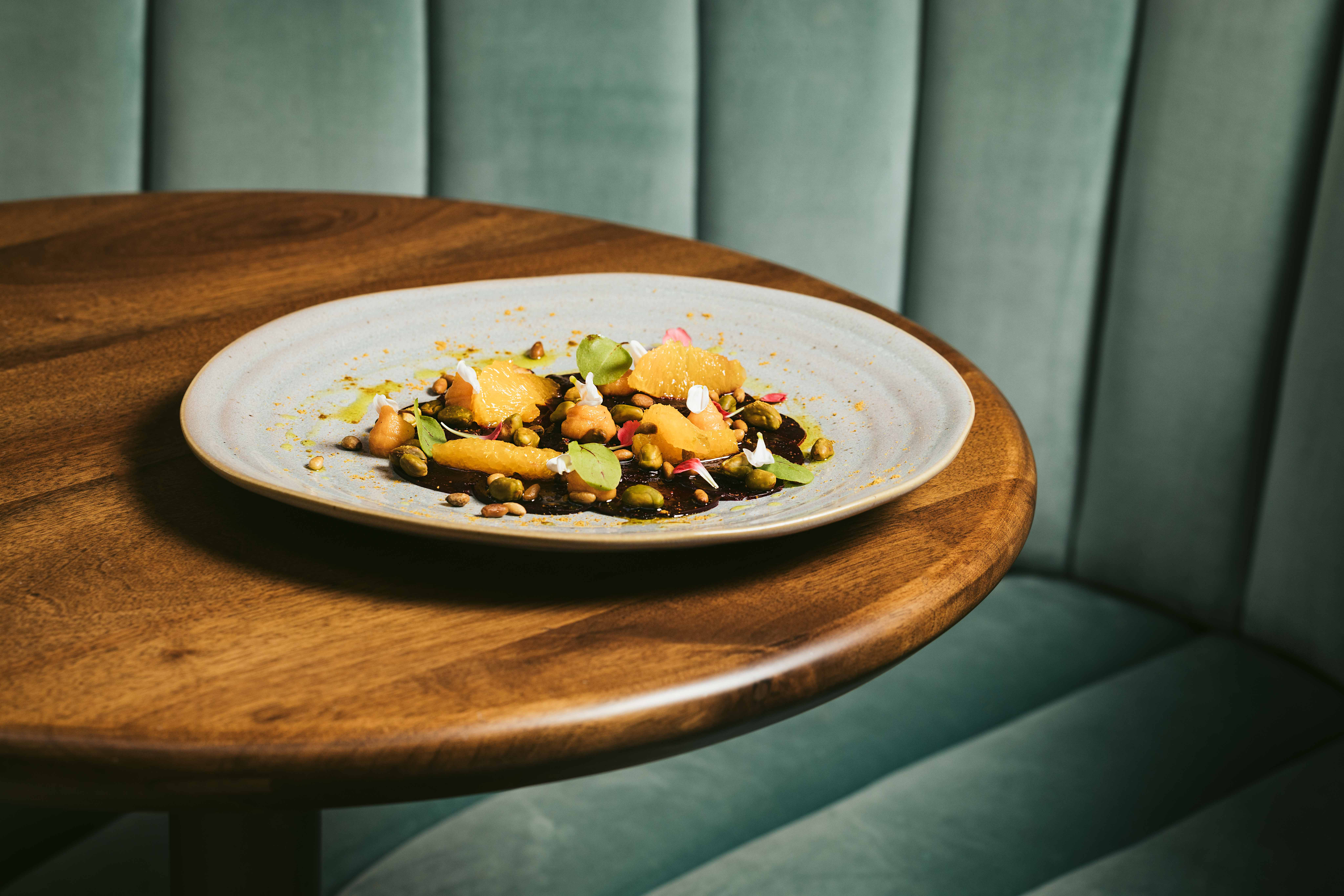 a pizza sitting on top of a wooden table