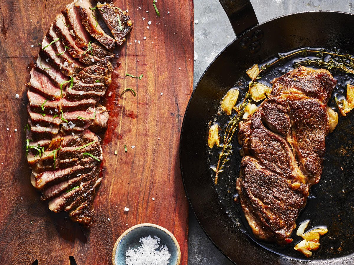 Steak and lamb in a pan