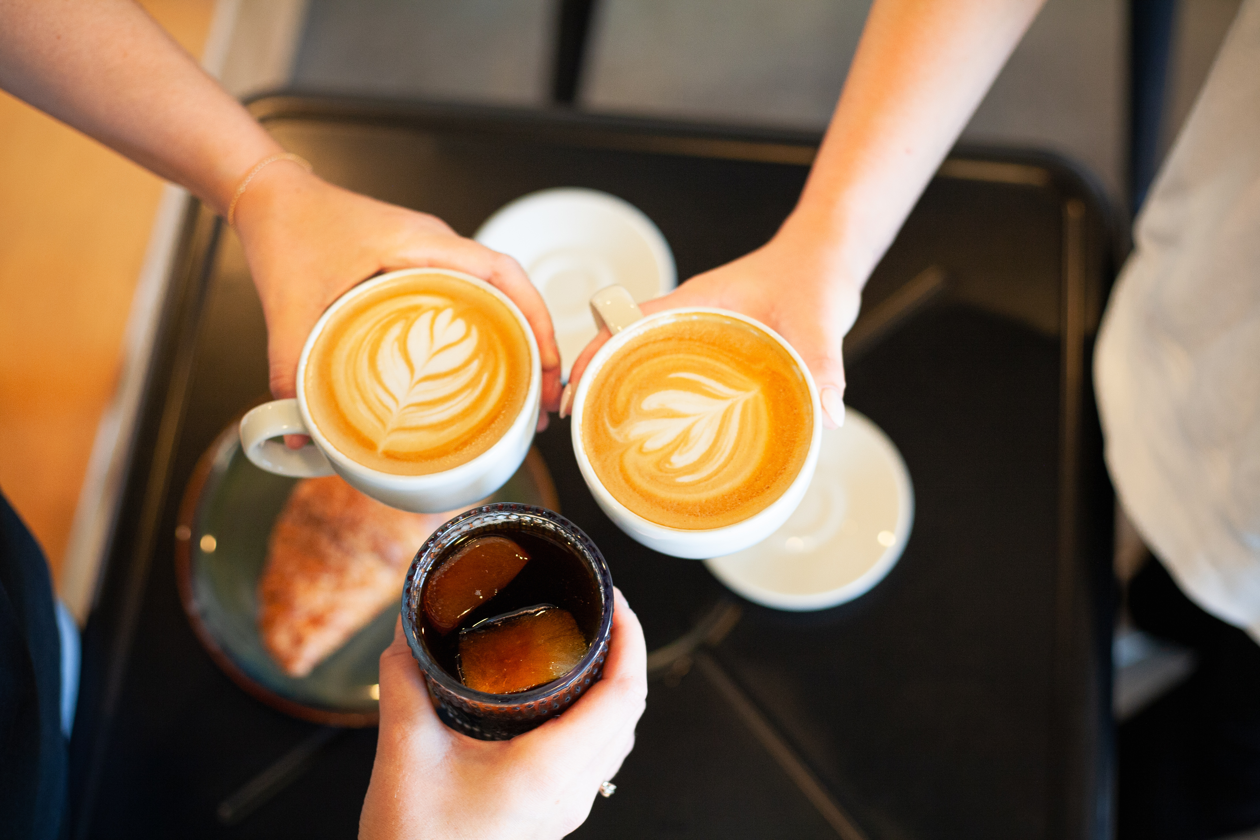 a person holding a cup of coffee