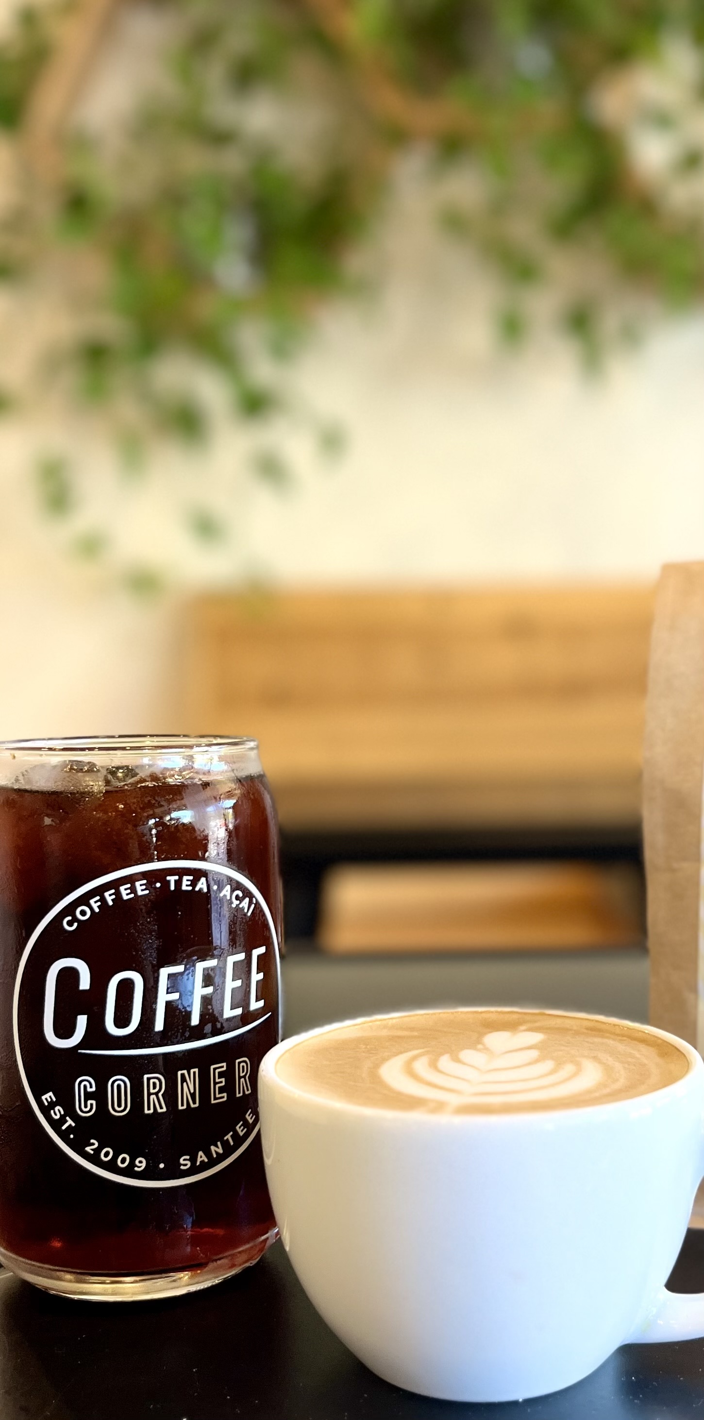 a cup of coffee and a glass of beer on a table