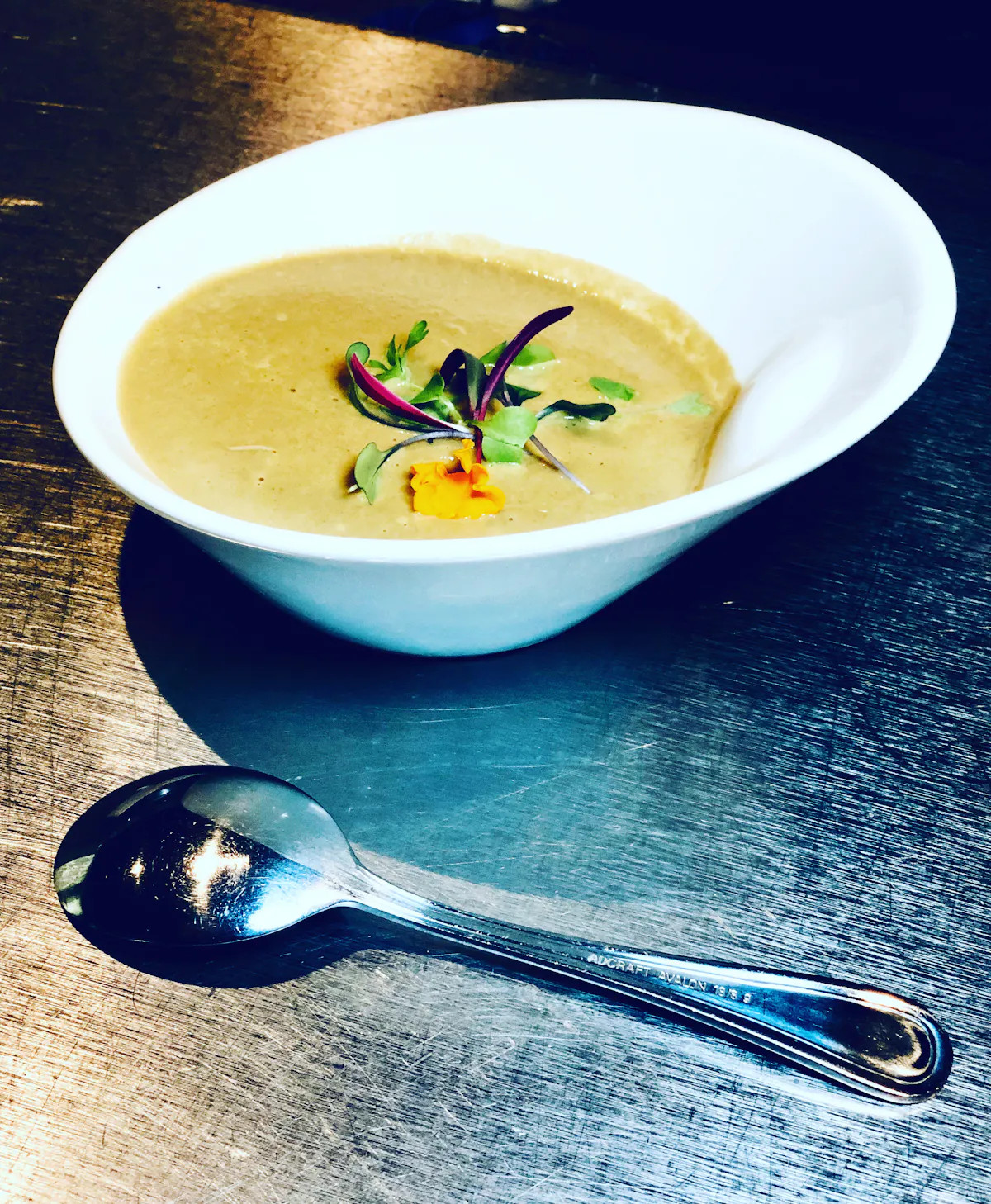 a bowl of food on a plate on a table