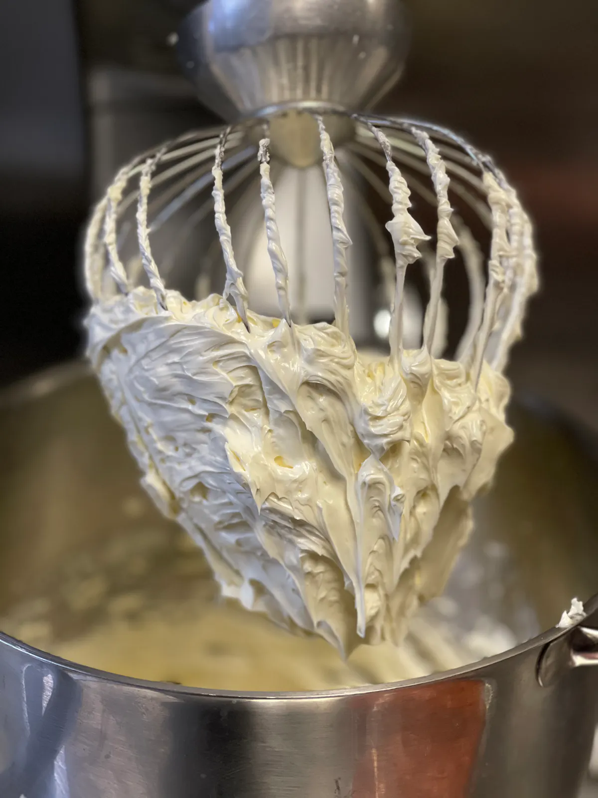a silver pot with a spoon