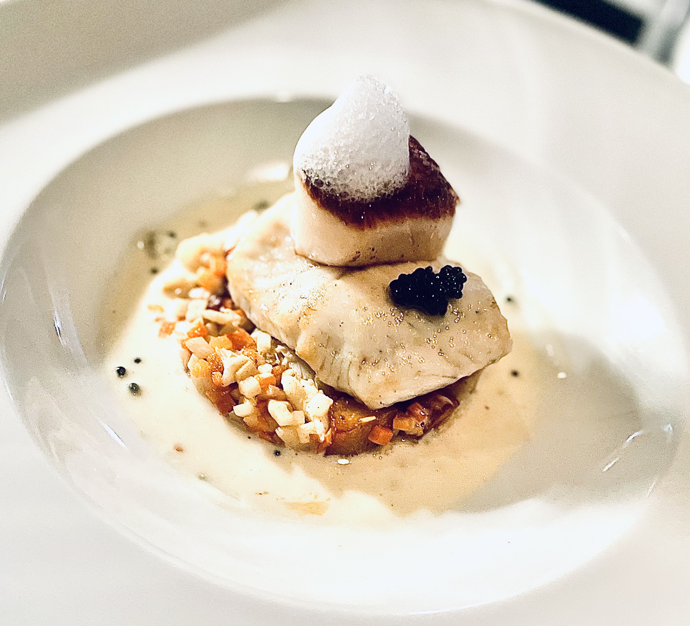 a piece of cake and ice cream on a plate