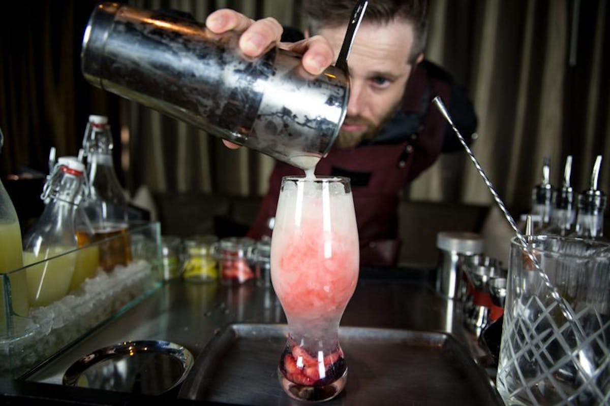 a person holding a wine glass