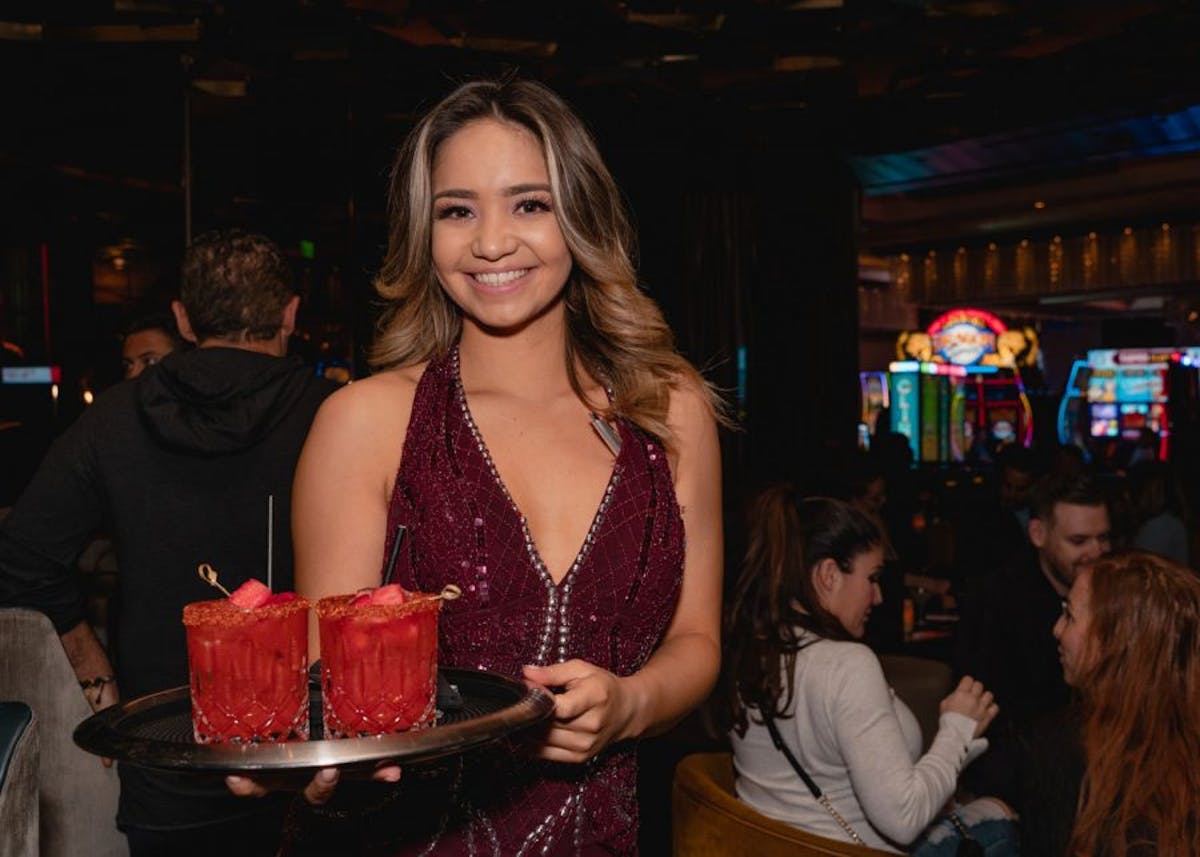 a person standing in front of a cake
