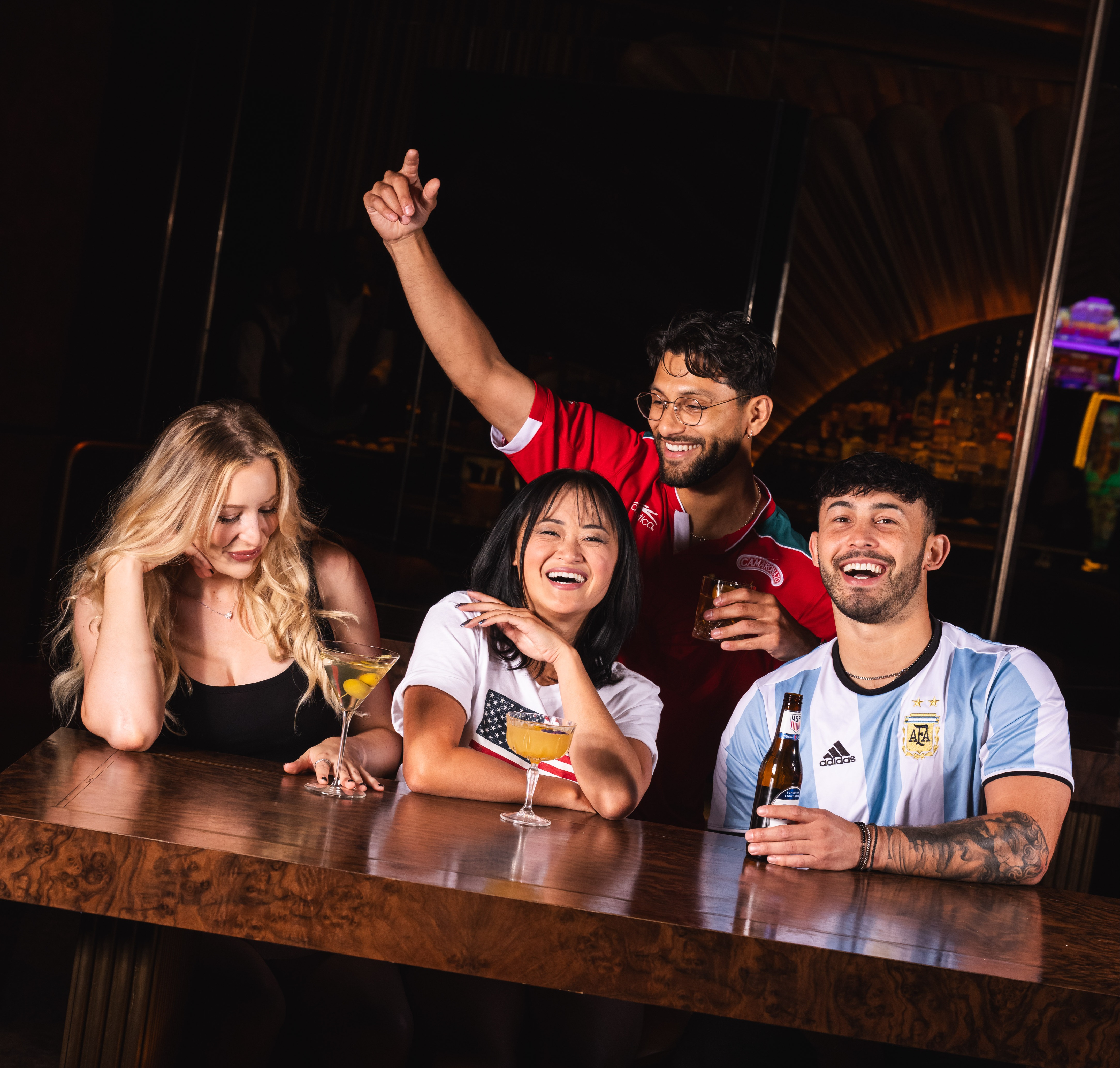 People watch world cup soccer at Clique Bar & Lounge in Las Vegas, NV.