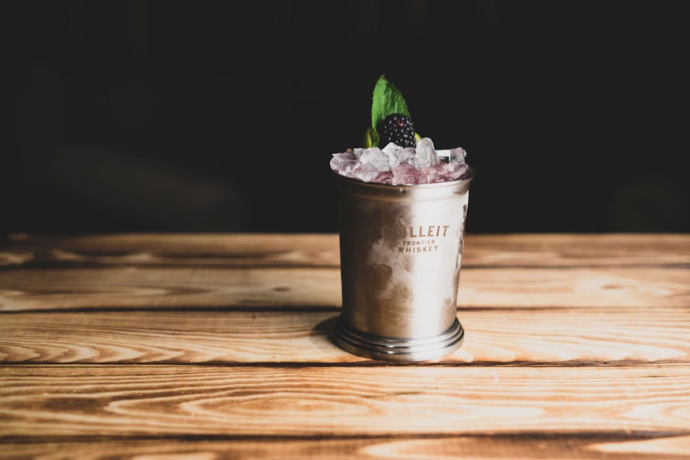 a vase sitting on top of a wooden table