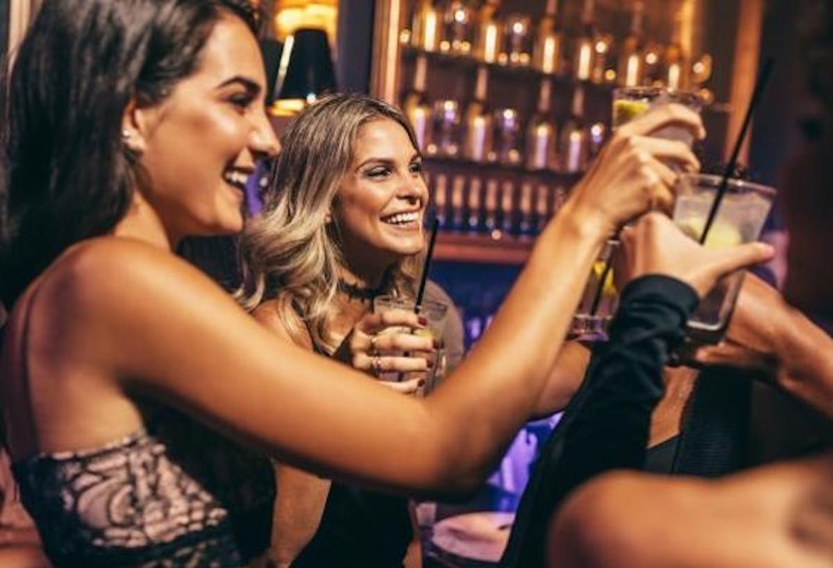 a person holding a wine glass