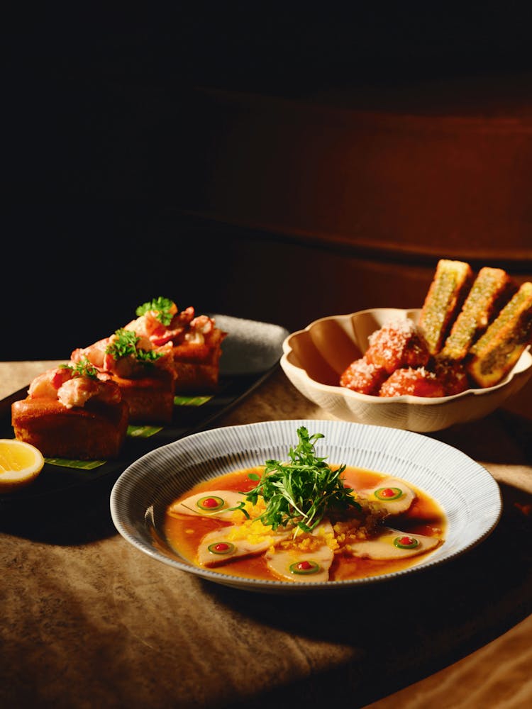 a bowl of food on a plate on a table