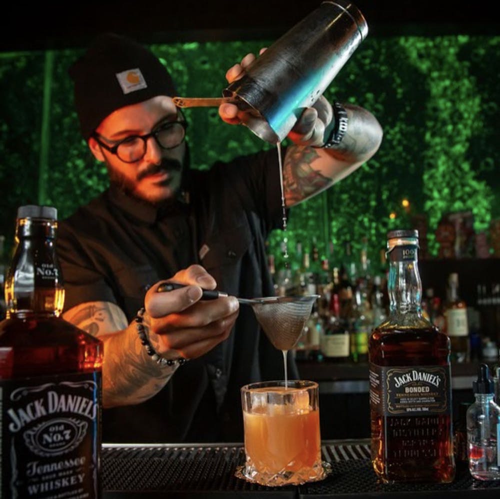 bartender making drinks for guests