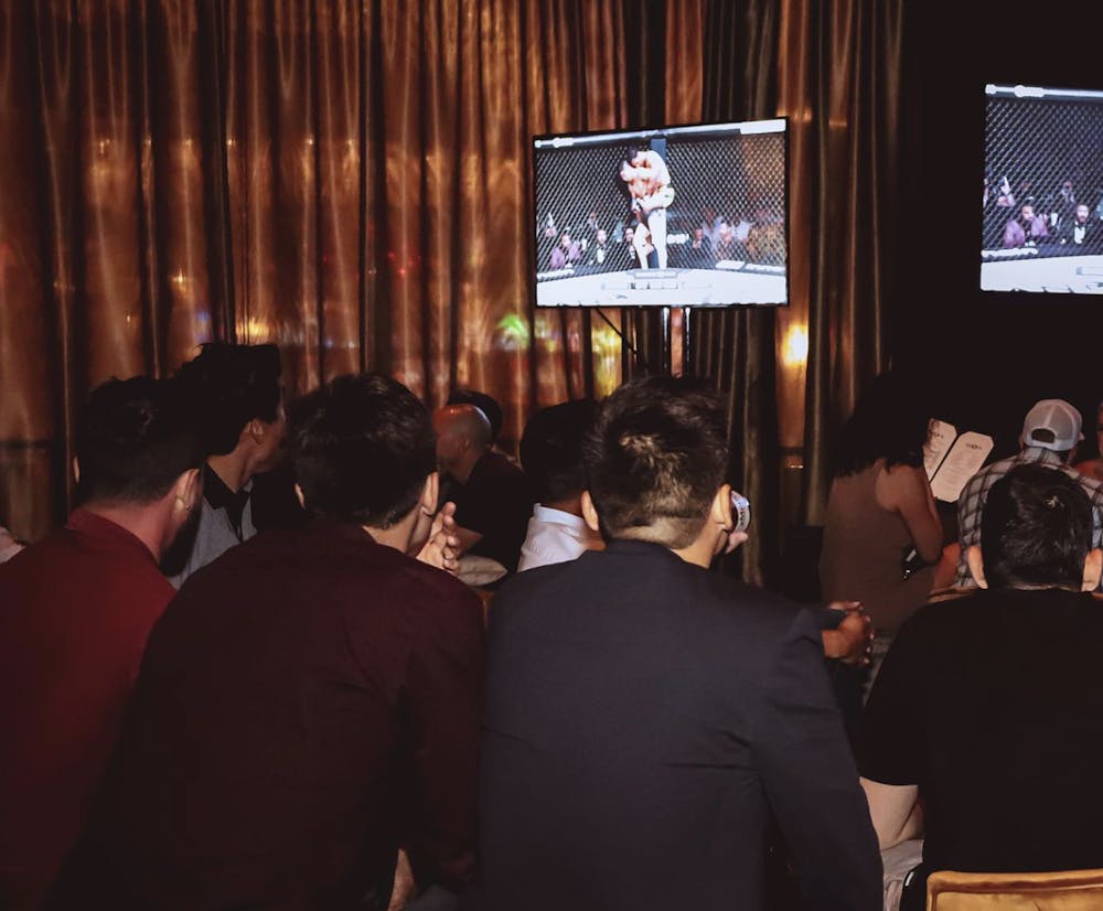 group at clique bar and lounge watching ufc