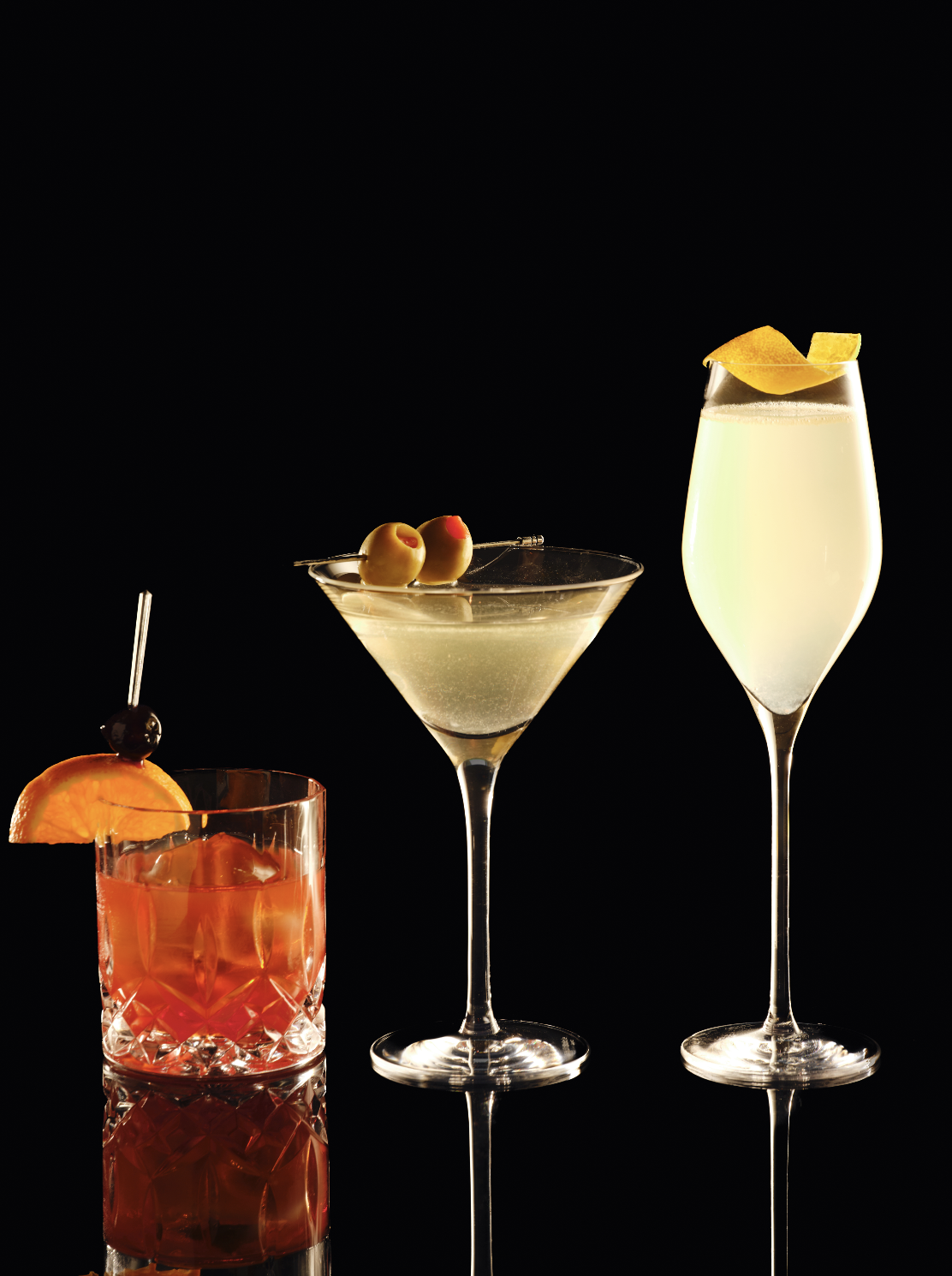 Old Fashioned, Dirty Martini, and French 75 from the Timeless classics menu at Clique, a cocktail bar in Las Vegas