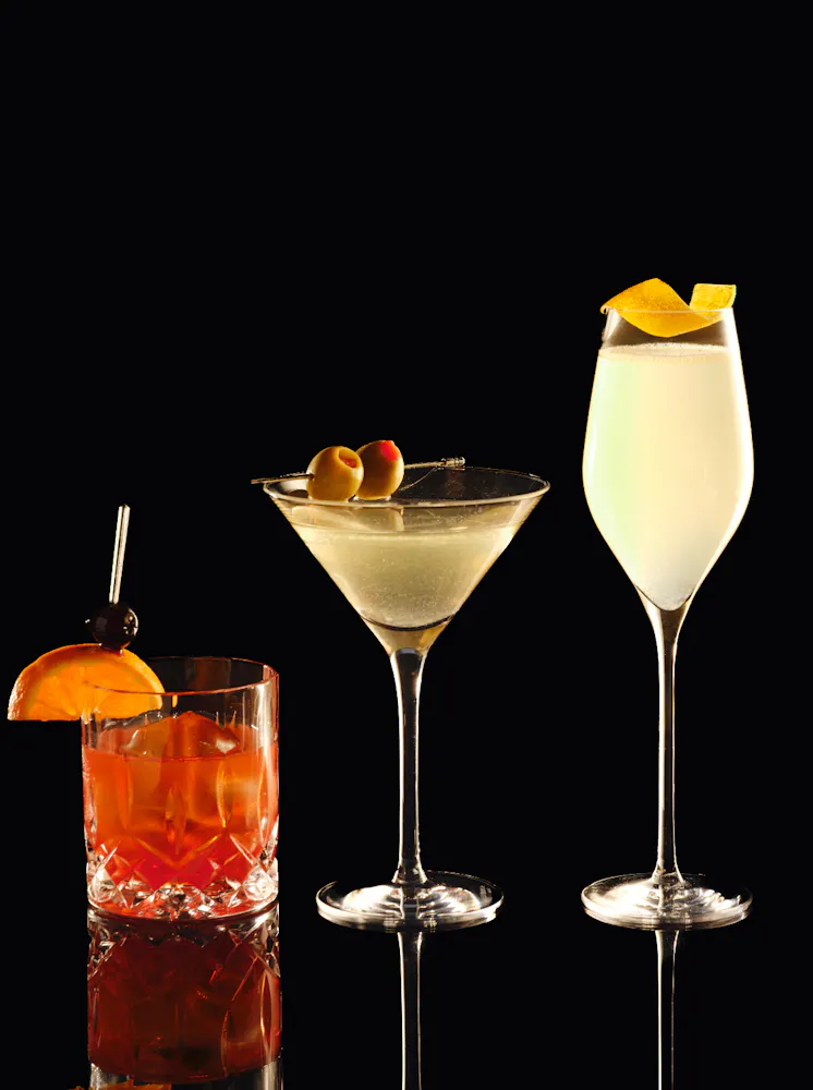Old Fashioned, Dirty Martini, and French 75 from the Timeless classics menu at Clique, a cocktail bar in Las Vegas