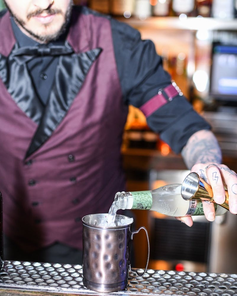 a person standing in front of a restaurant