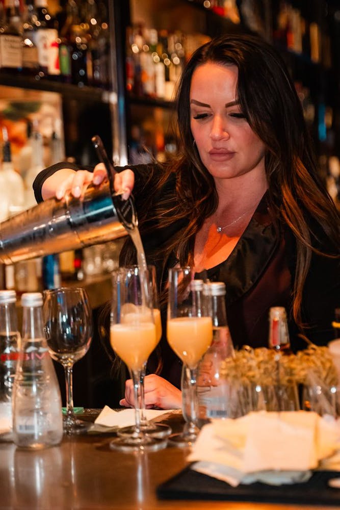 girl pouring drink at Las Vegas lounge