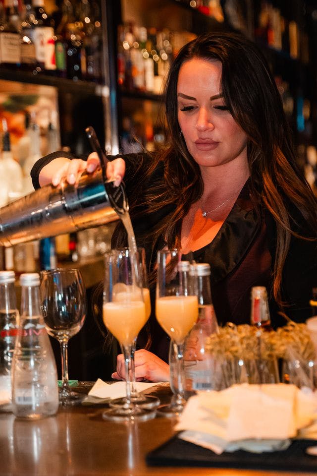 girl pouring drink at Las Vegas lounge