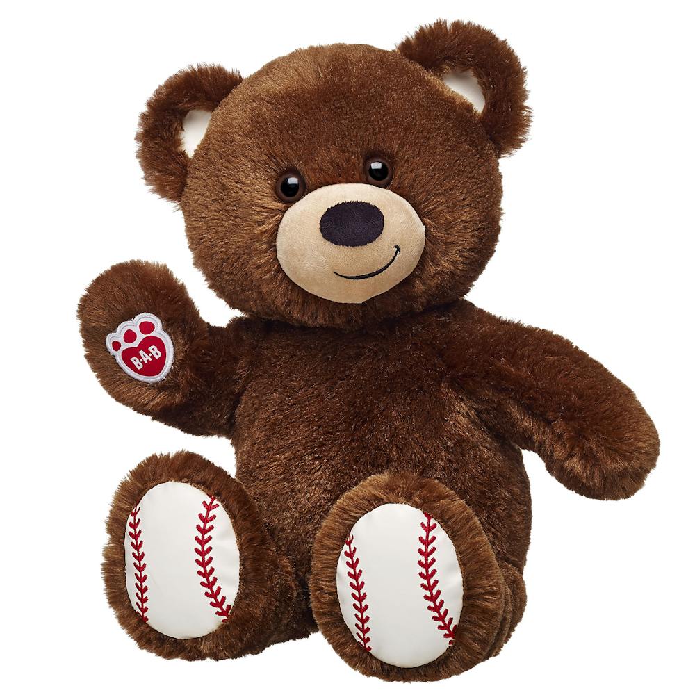 a brown teddy bear sitting on top of a stuffed animal