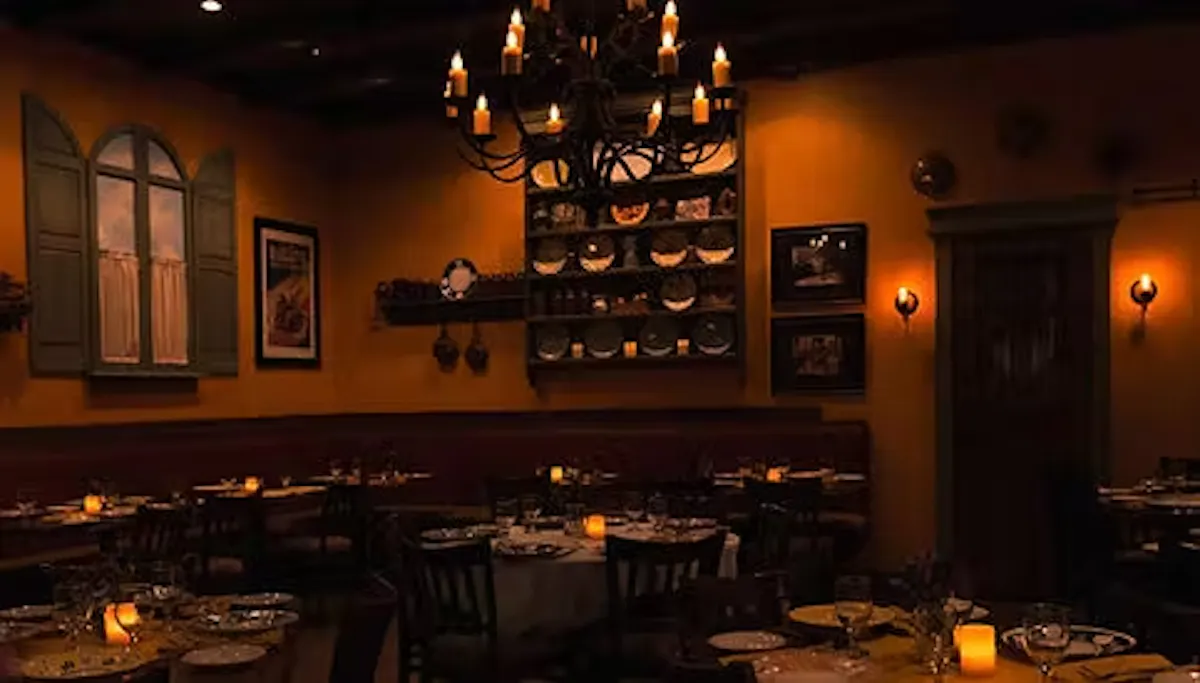 a kitchen with a table in a dark room