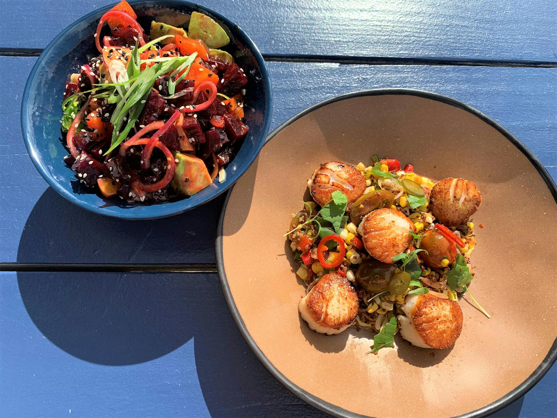 a plate of food with rice meat and vegetables