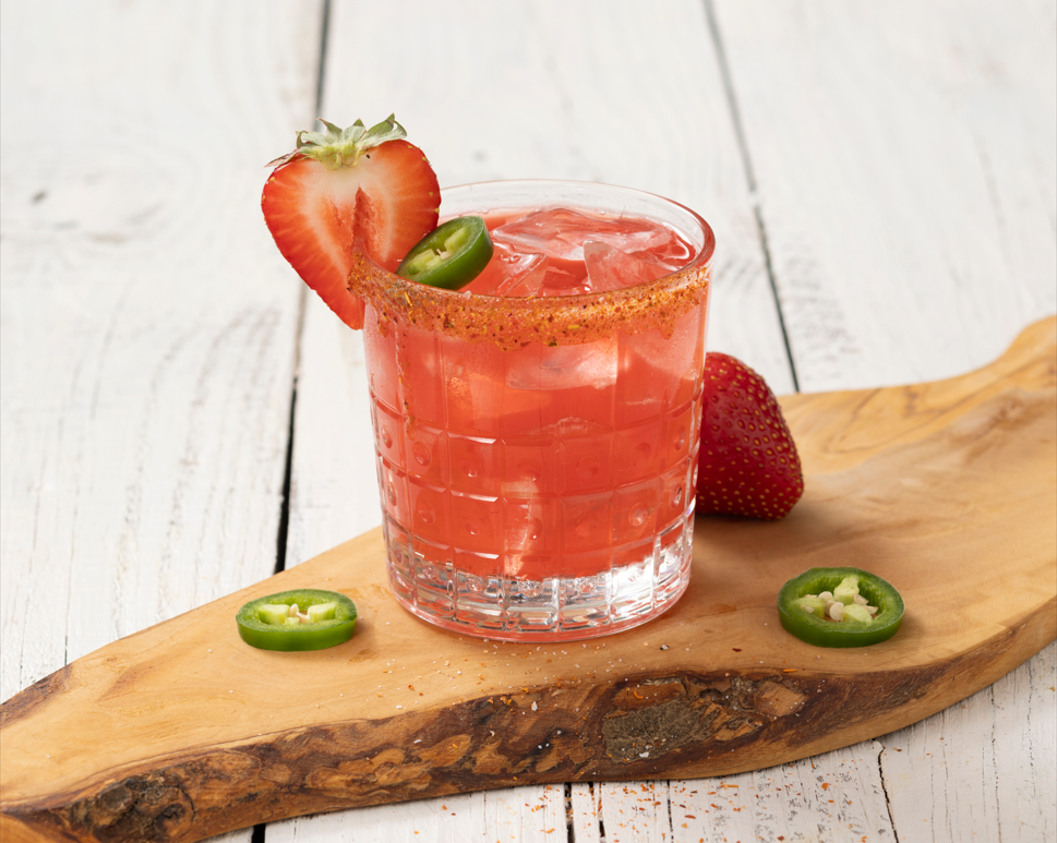 a banana sitting on top of a wooden cutting board