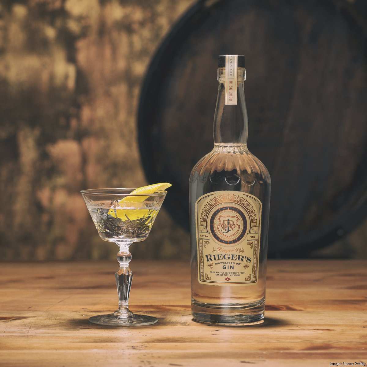 a bottle of wine sitting on top of a wooden table