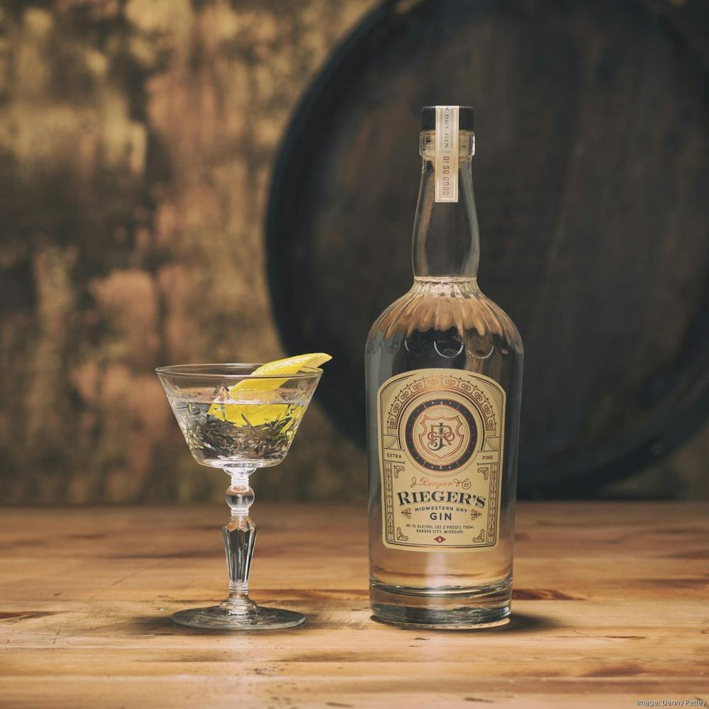 a bottle of wine sitting on top of a wooden table