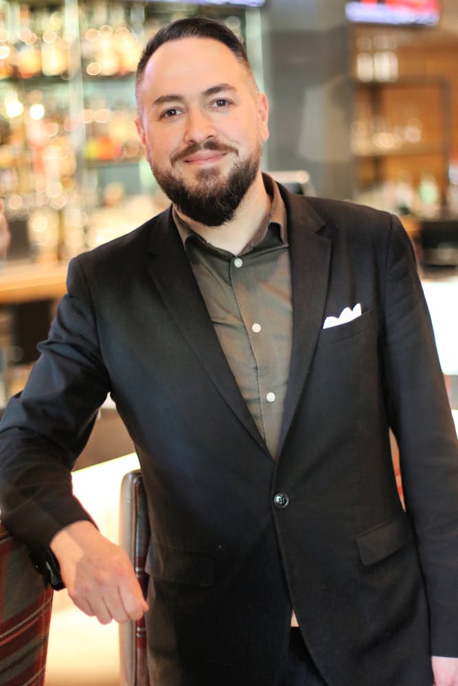 a man standing in front of a store