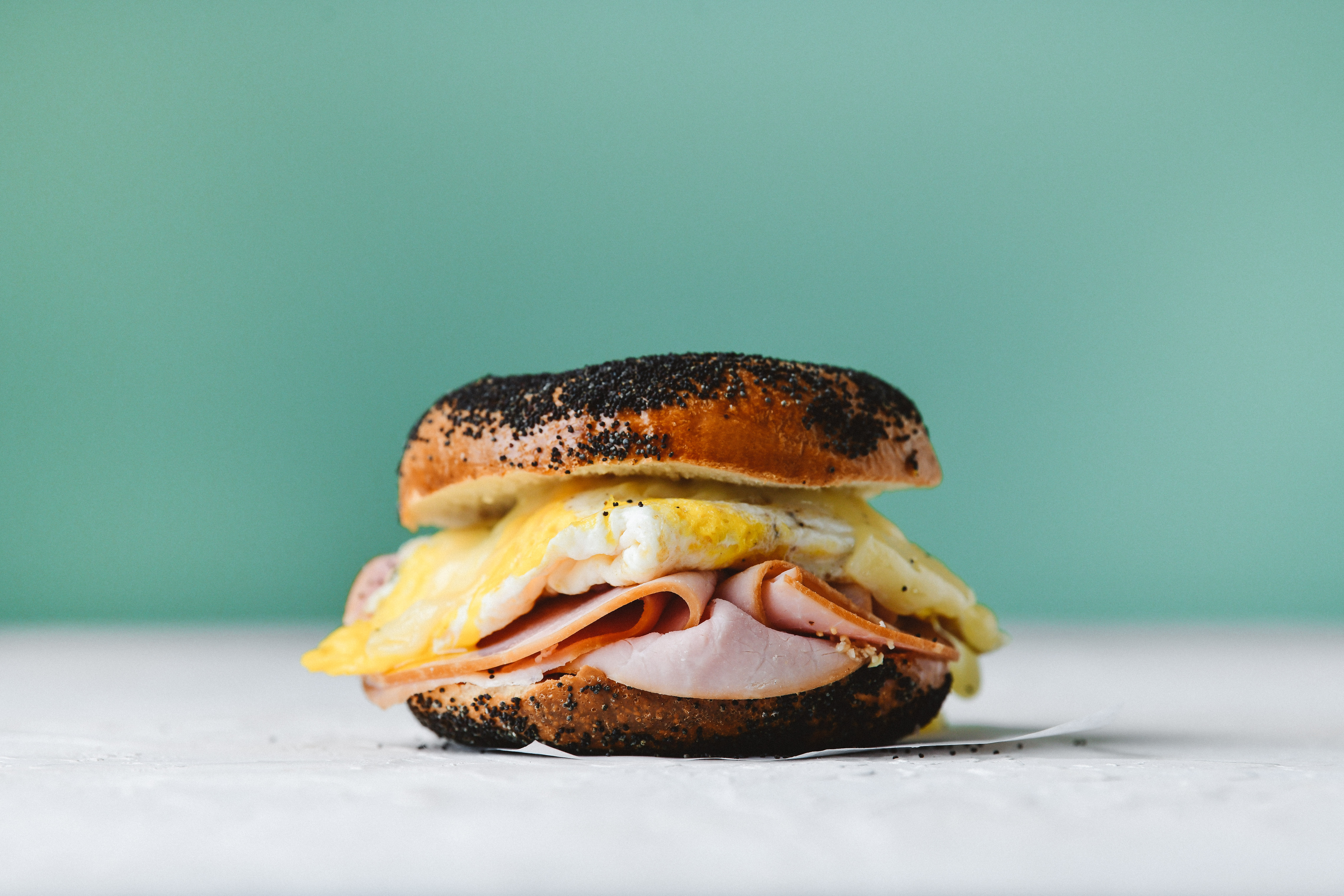 a half eaten sandwich on a plate