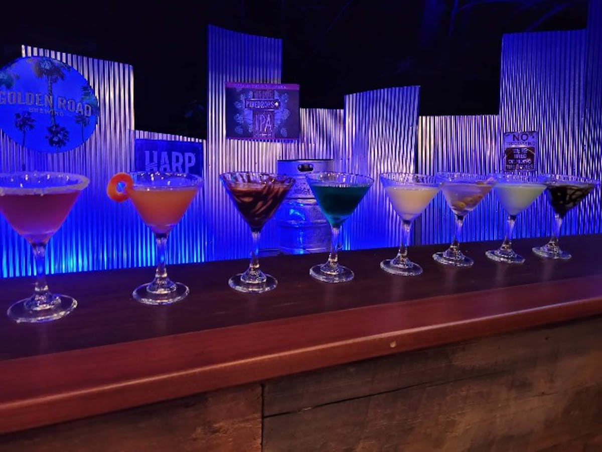 a row of wine glasses on a table