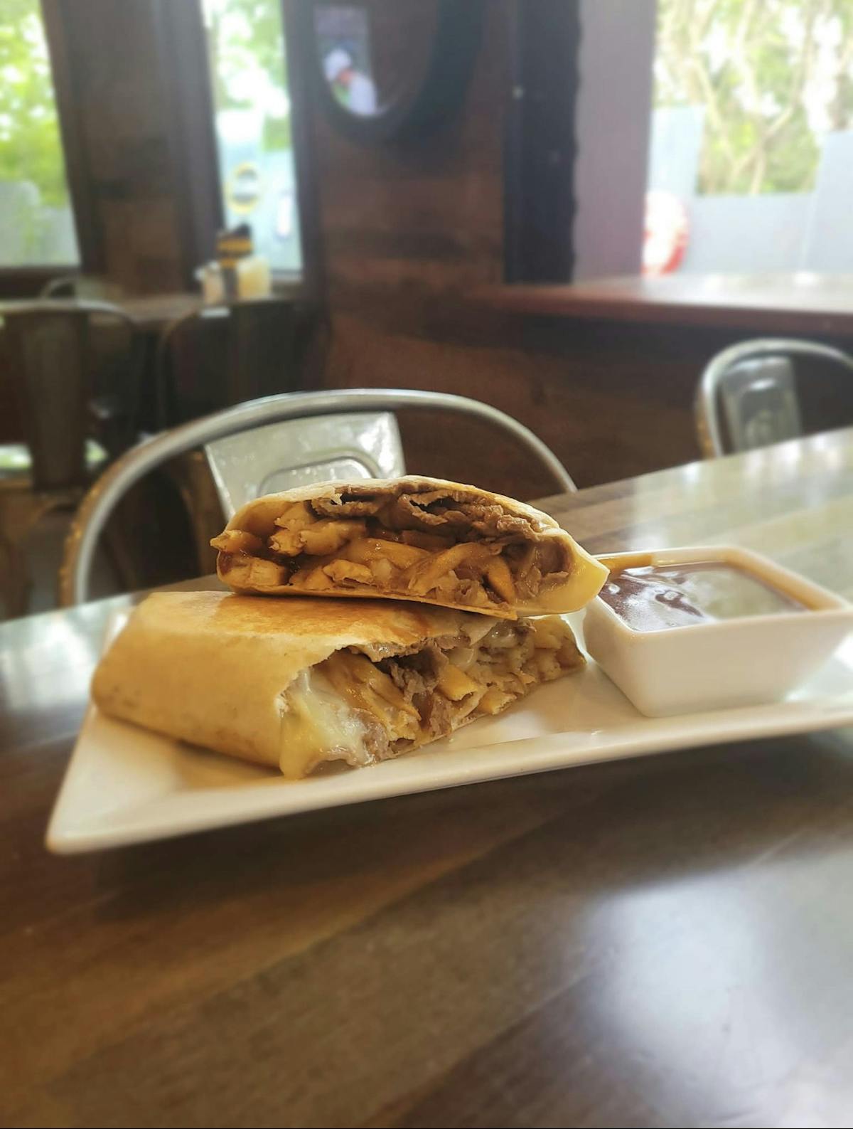 a sandwich sitting on top of a wooden table