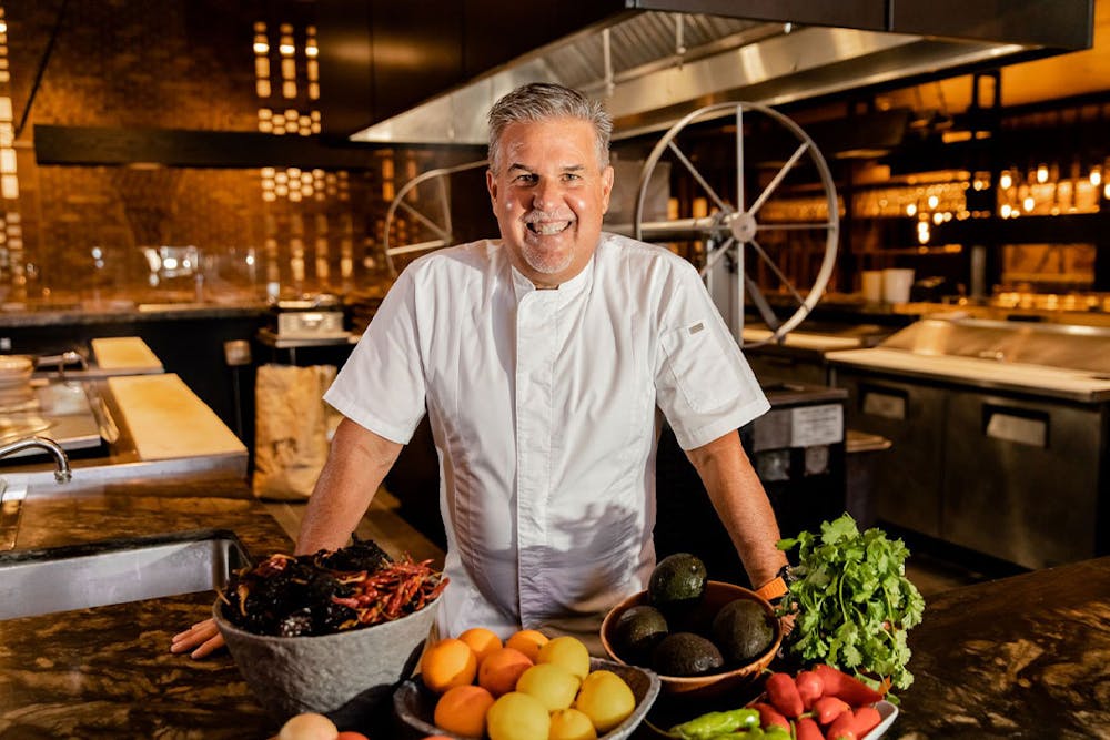 a man preparing food in a kitchen