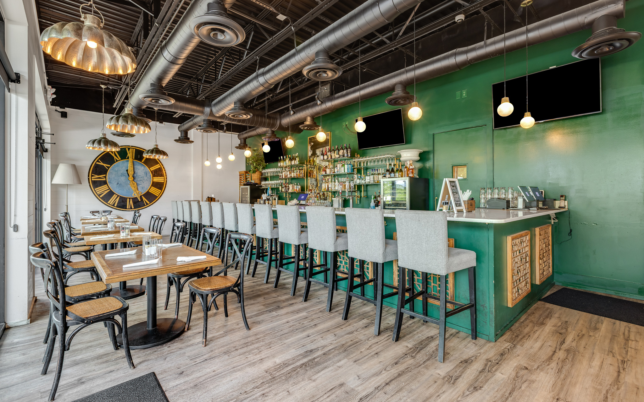 a bar with tables and chairs