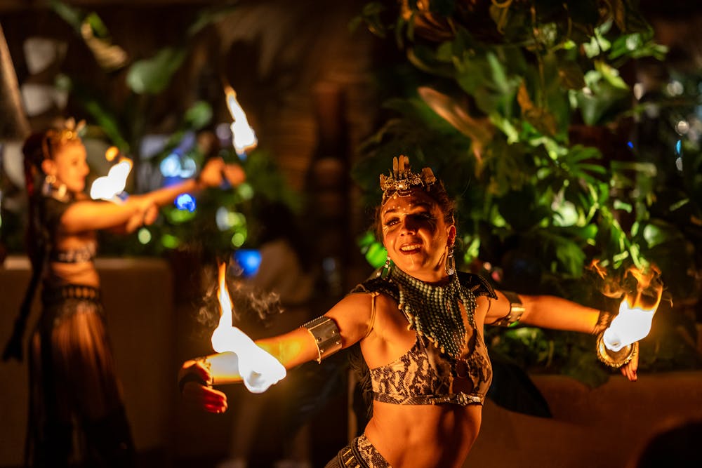 two fire performers dazzling guests with performance
