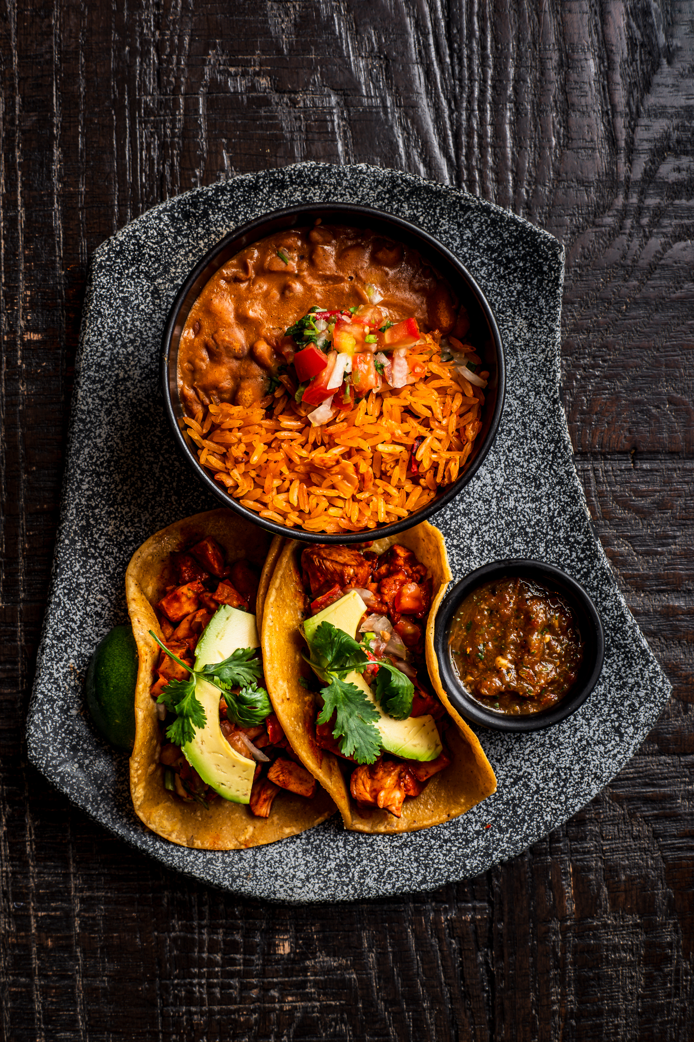 Tacos with rice and salsa at Amaya Modern Mexican