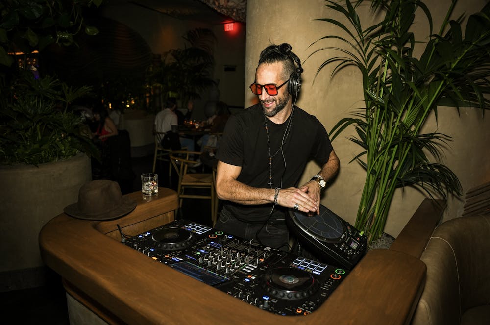 dj performing and creating energetic atmosphere with rhythmic music