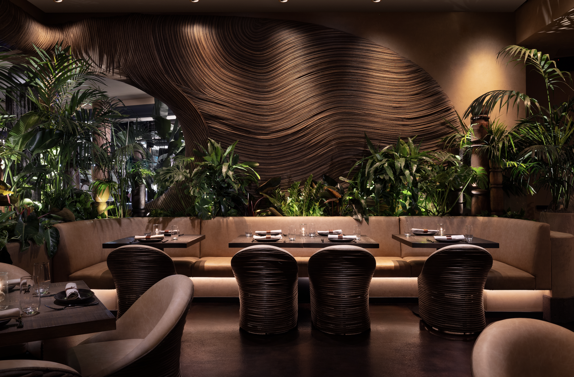 a room filled with furniture and vase of flowers on a table