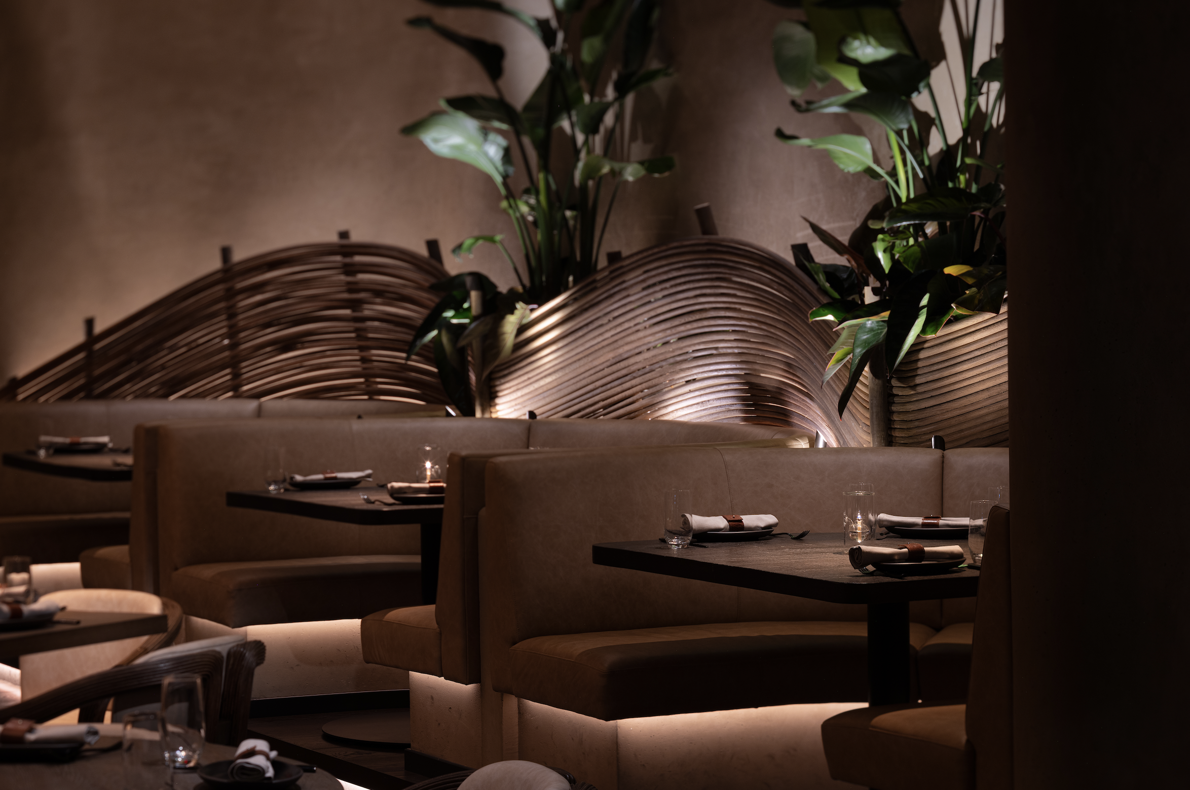 Amaya Modern Mexican interior with wooden tables and luxe greenery