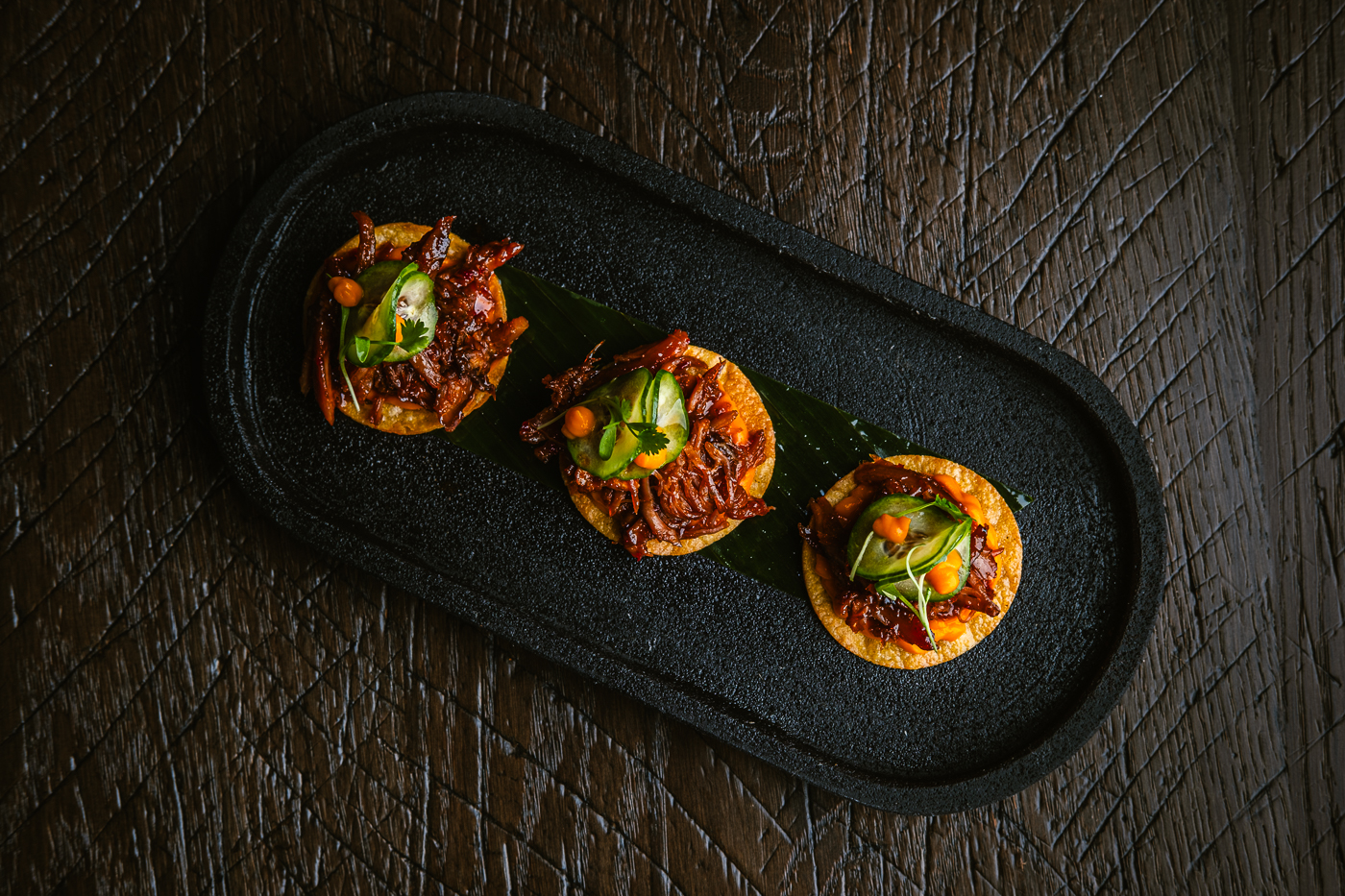 a photo of the duck confit tostadas that will be served at Amaya Modern Mexican at the cosmopolitan of las vegas
