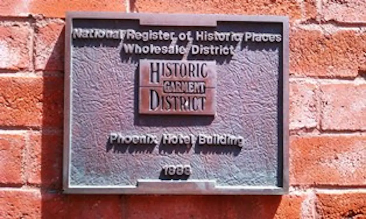 a sign in front of a brick building