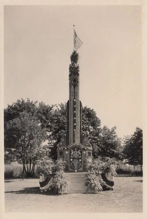 a cat sitting on top of a tower