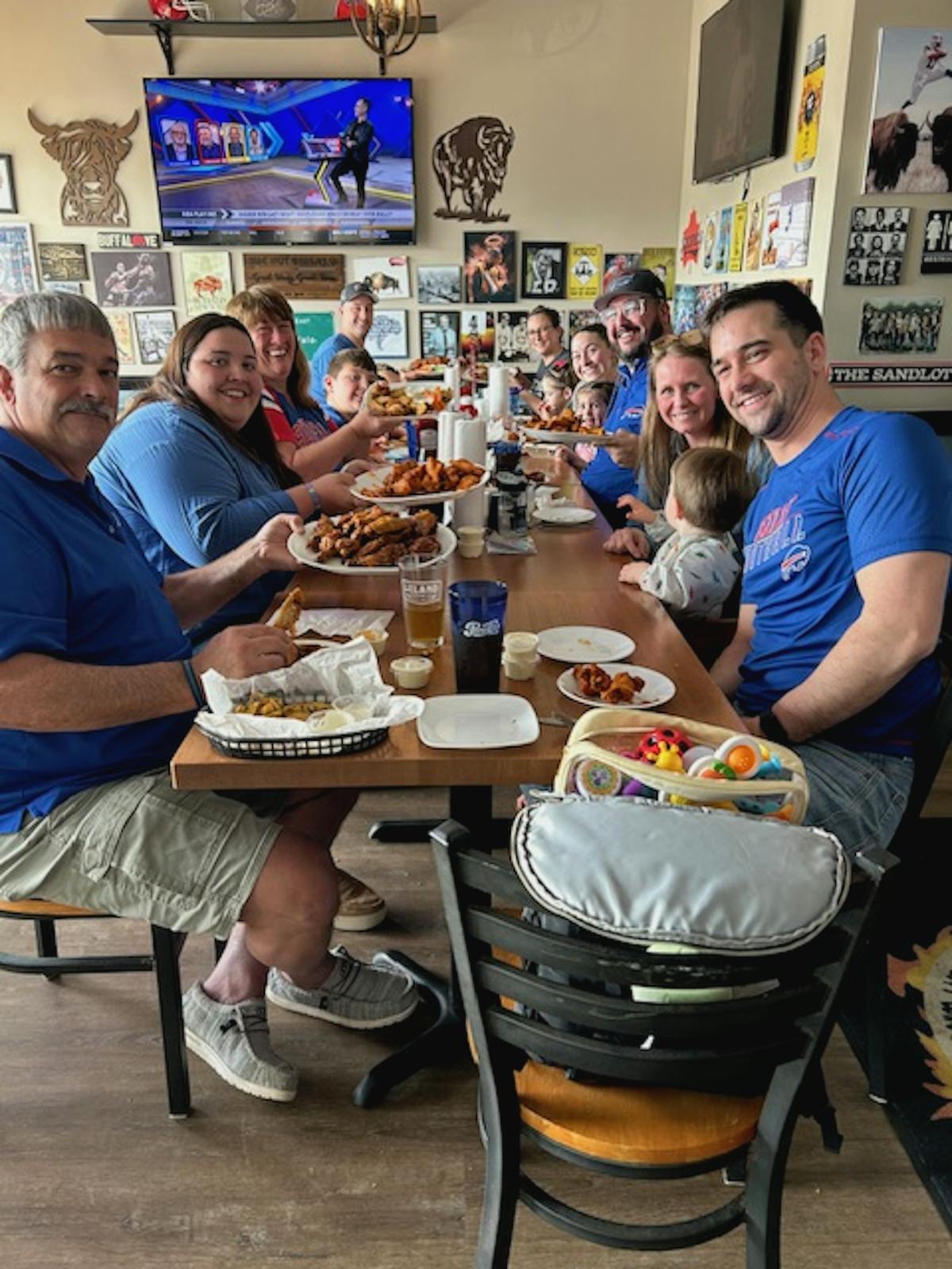 a group of people sitting at a table eating food