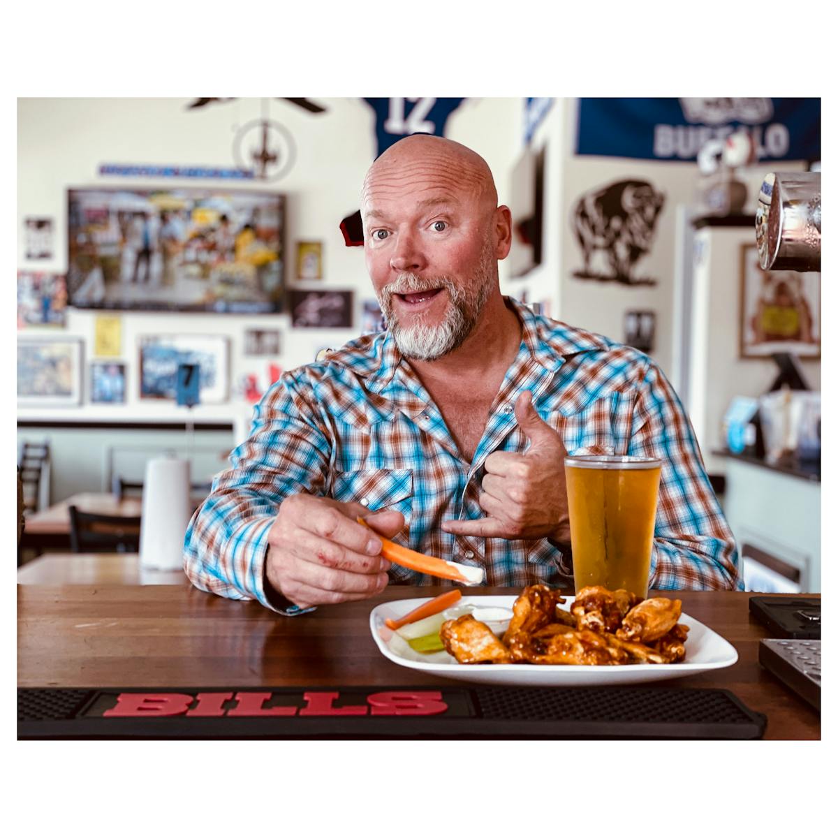 a man sitting at a table with food