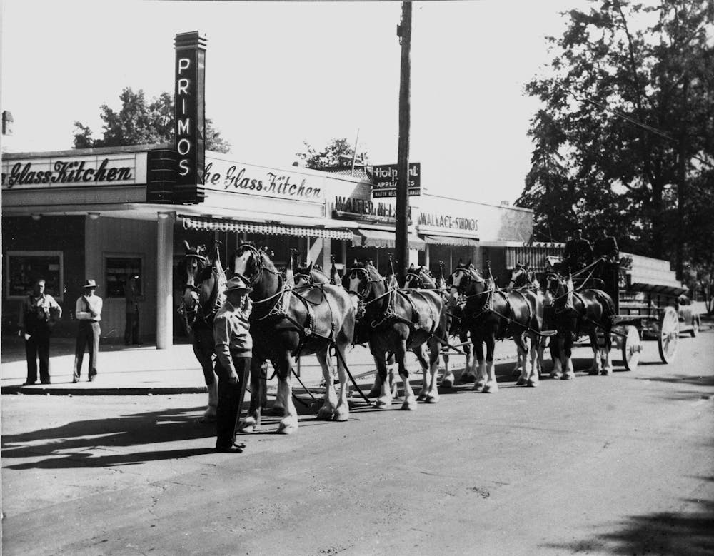 a group of people walking down the street