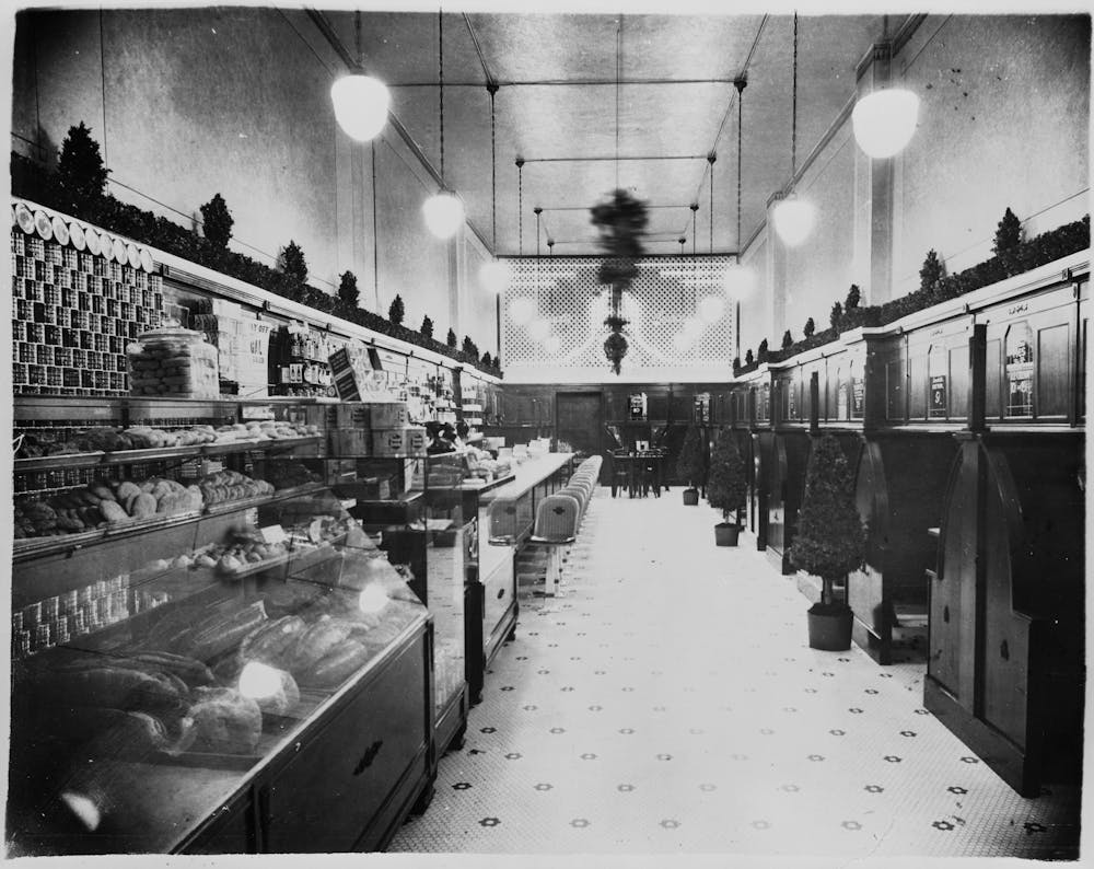 an old photo of a group of people standing in a room