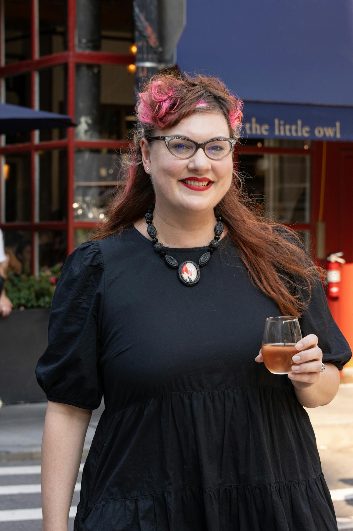 a woman wearing glasses talking on a cell phone