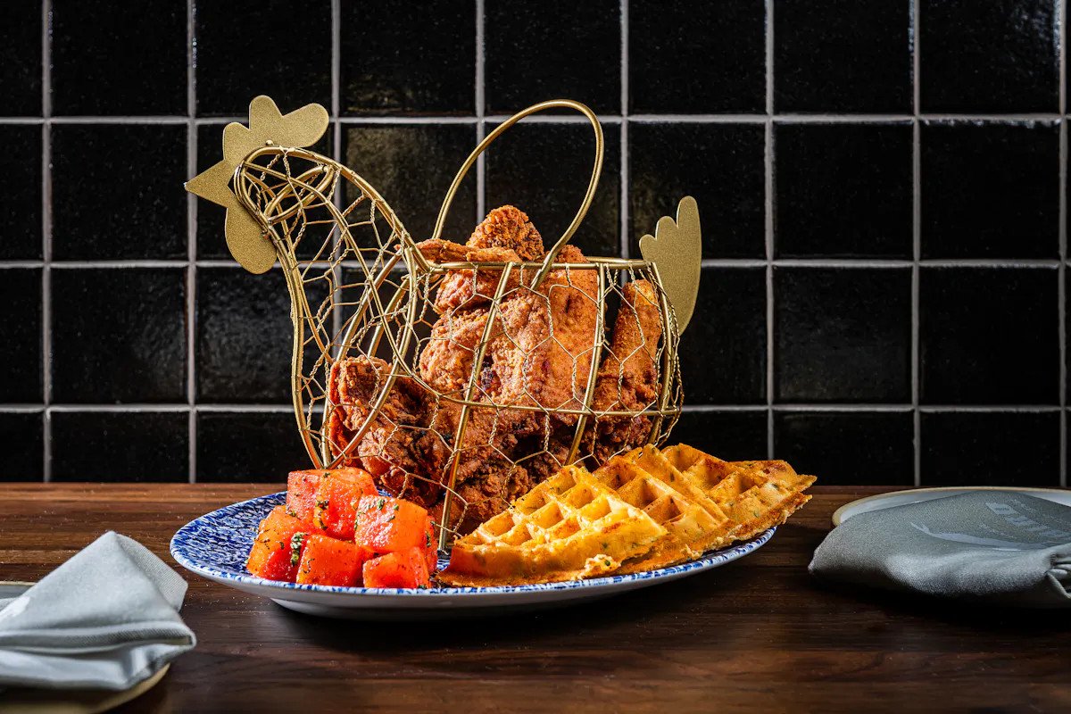 a bowl of oranges on a table