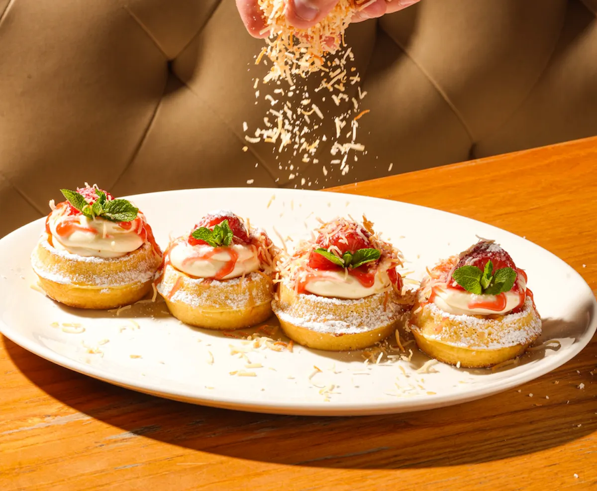 a plate of desserts with sprinkles