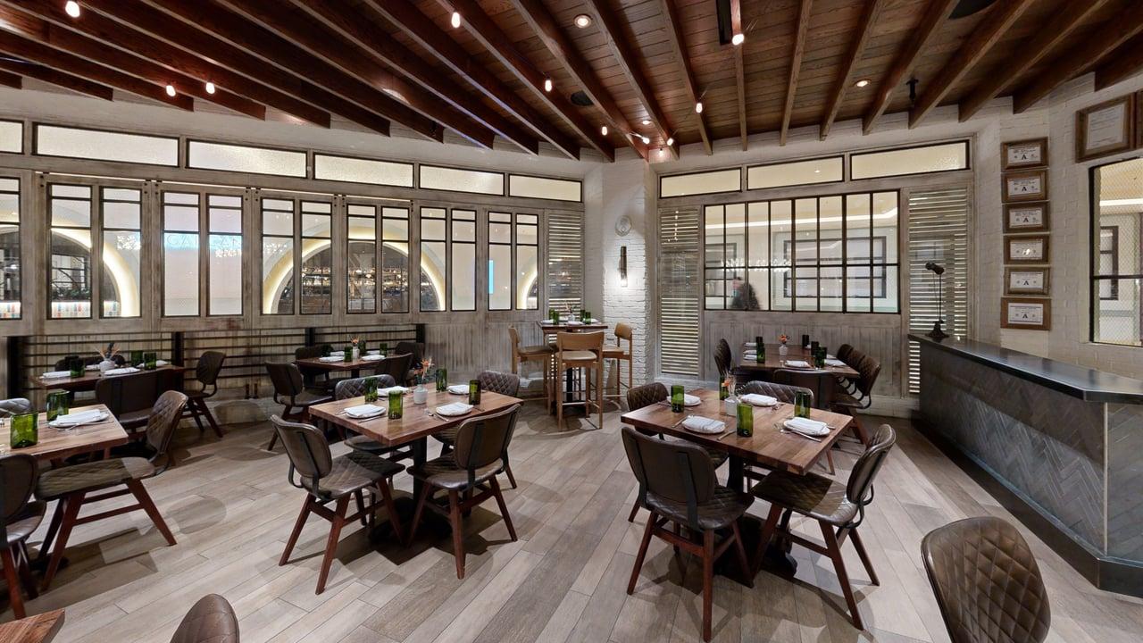 a living room filled with furniture and a large window