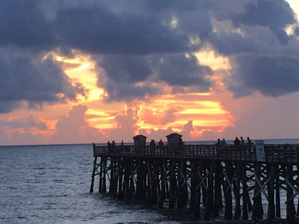 a sunset over a body of water