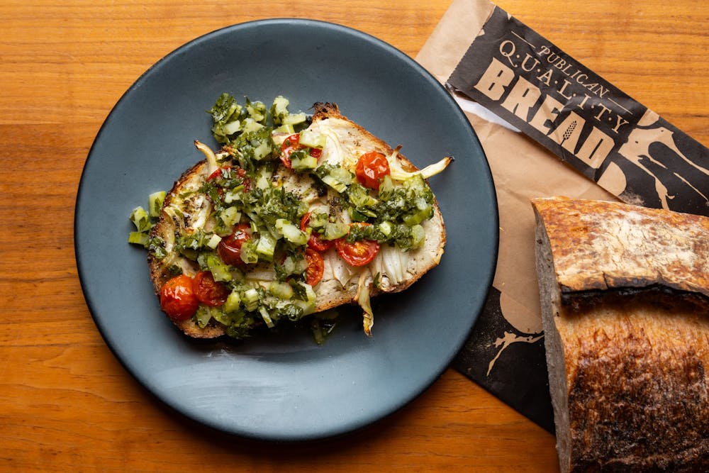 a plate of food sitting on top of a wooden table